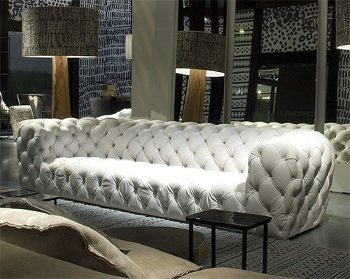 Exceptional tufted leather sofa and chair by baxter for Baxter paola navone