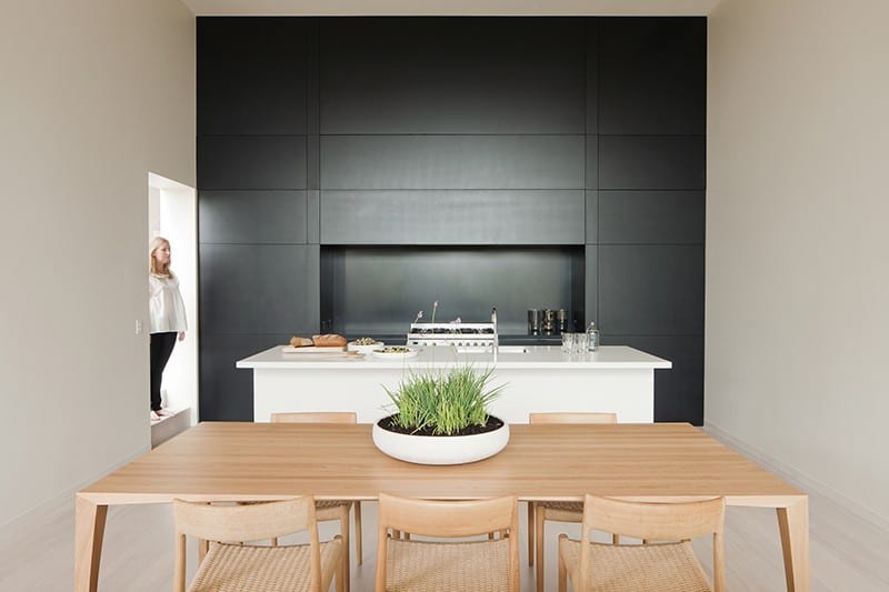 Black and white minimalist kitchen by StudioFour
