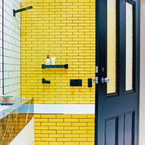 Bright yellow tiles 285x285 Shower Tile Designs for Each and Every Taste