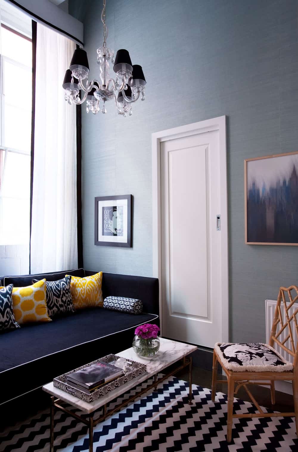 nook-living-room-navy-daybed-faux-bamboo-occasional-chair-yellow-and-blue-print-cushions-light-teal-grasscloth-wallpaper-black-white-window-dressing-zigzag-rug-diane-bergeron