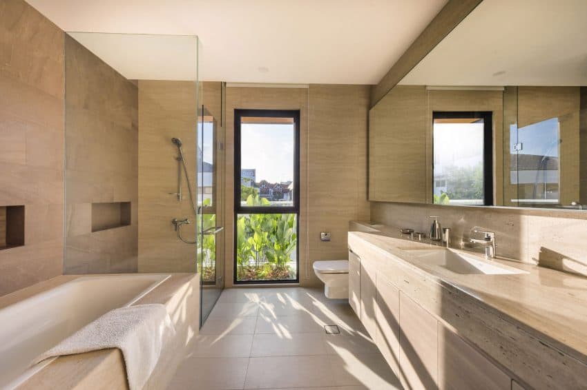 Bathroom features a window and lively green accents