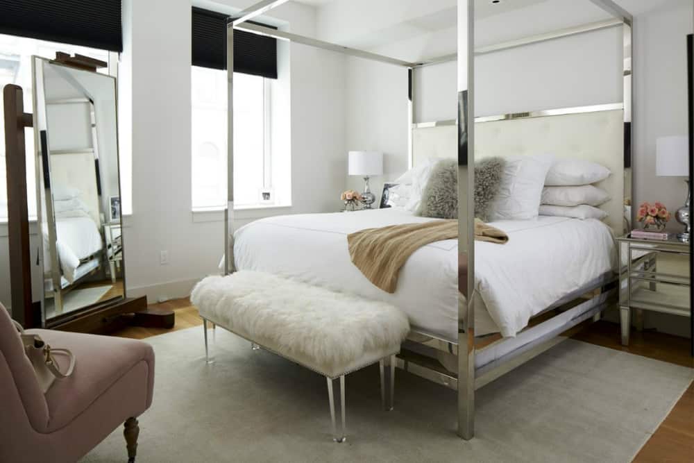 Ariel of Something Navy bedroom makeover features a mirrored canopy bed