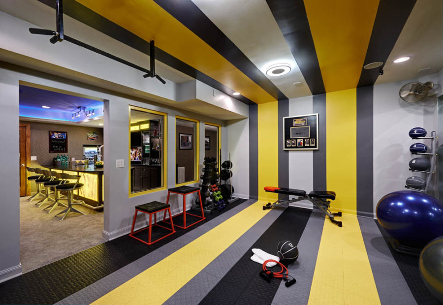 Basement home gym and bar by Vonn Studio