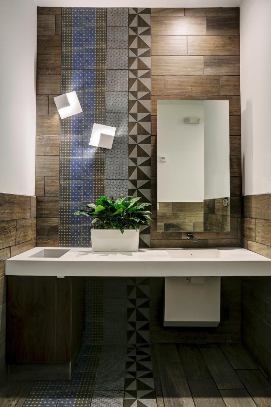 Bathroom accent wall in wood look tiles by Gin Braverman
