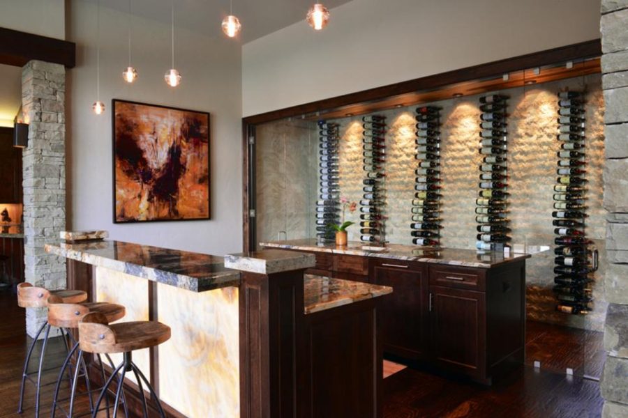 Luxurious basement bar design by AVID Associates