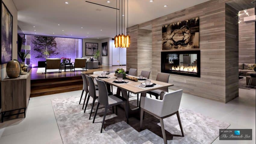 Open plan dining room has its own zone with a fireplace