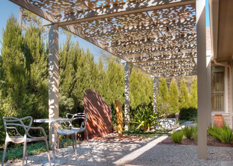 Patio under aluminum arbor by Exterior Worlds Landscaping