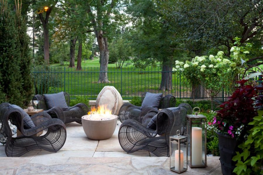 Stone patio with statement chairs