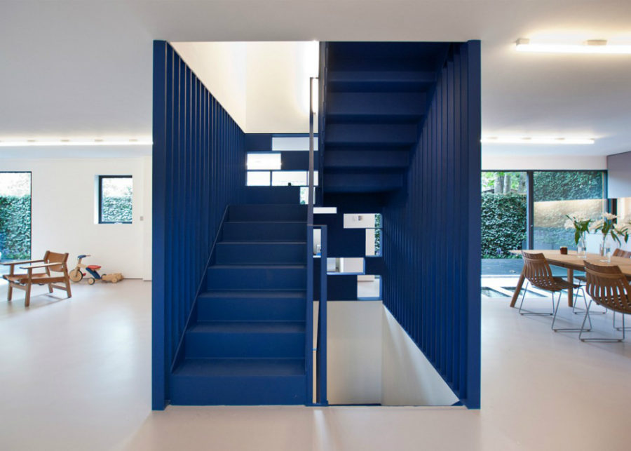 Blue steel staircase with a bookcase