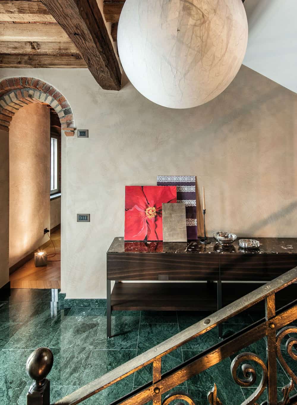 Foyer floors are covered with green marble tiles