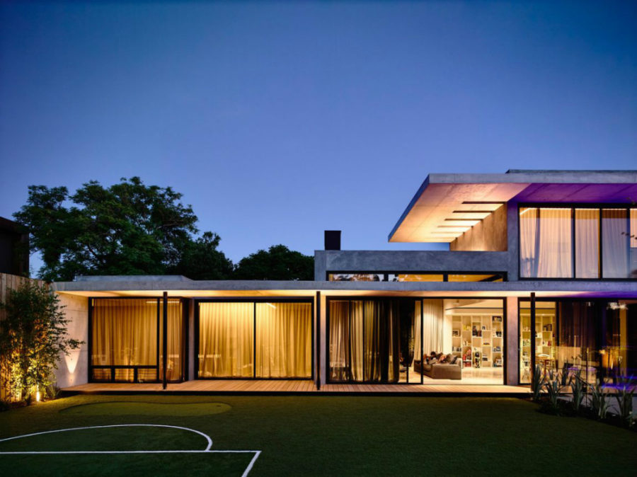 Glass-heavy house design is protected by numerous curtains