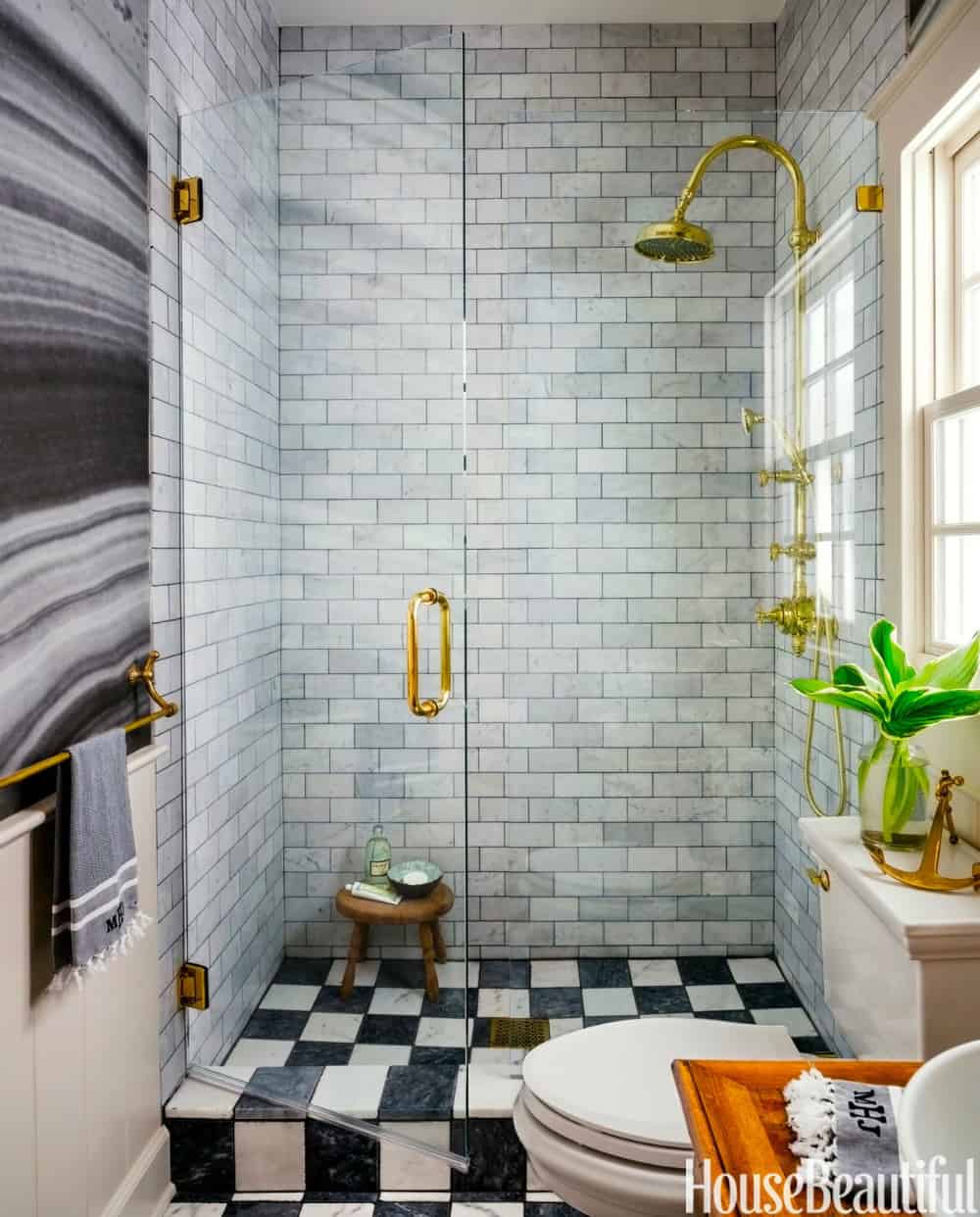 Marble subway tiles in a small shower