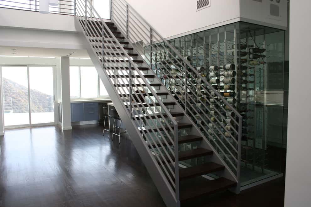 Staircase wall glass-enclosed wine cellar
