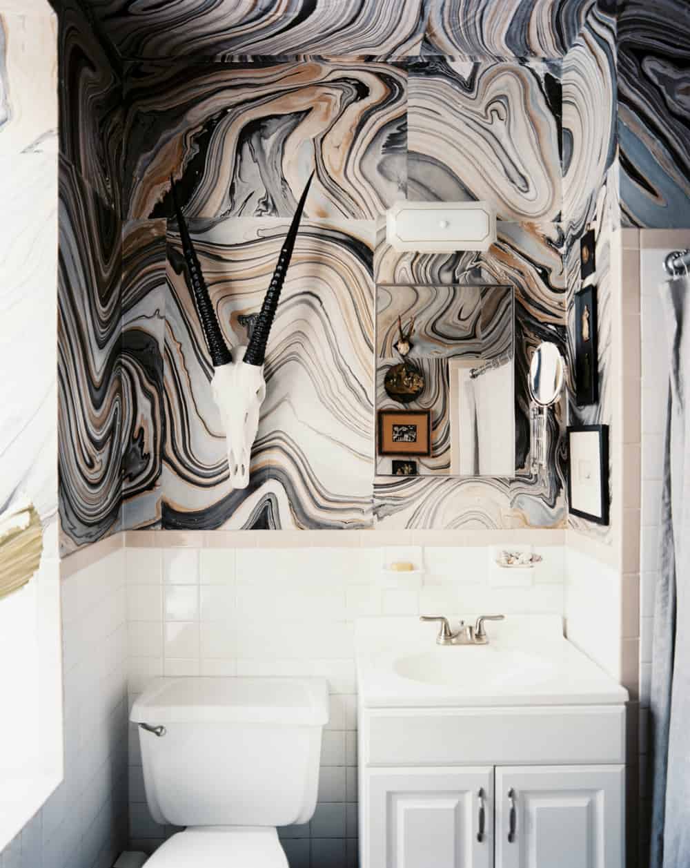 Stone-like wallpaper feature wall in a powder room