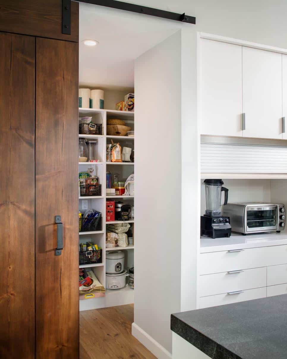 Walk-in pantry with a sliding barn door