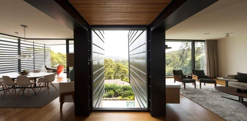Wall-sized window brings airiness to the transitional space