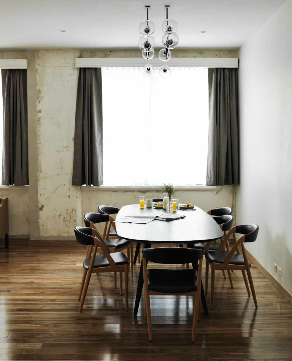 A dining area in a room with distressed walls