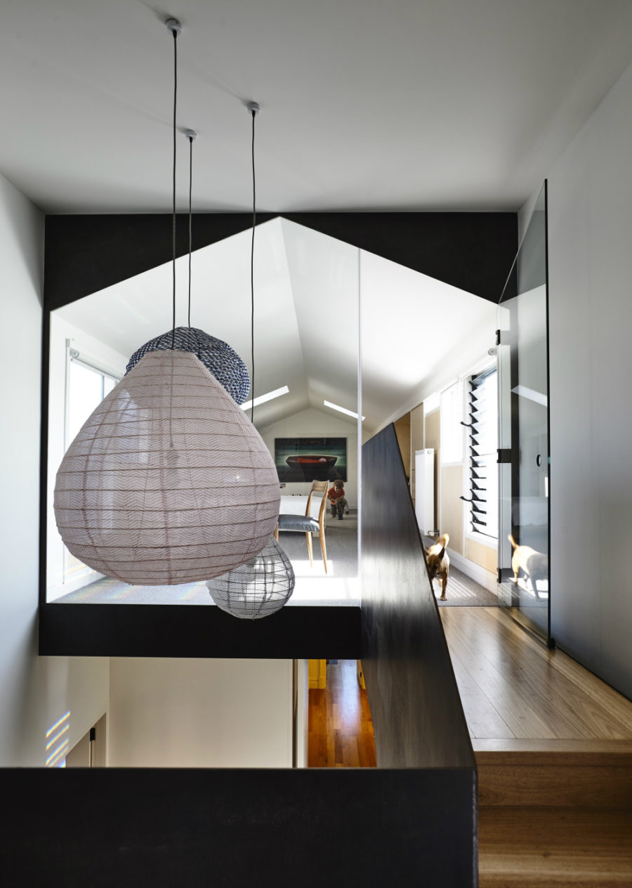 A group of different pendants illuminated and decorate the staircase