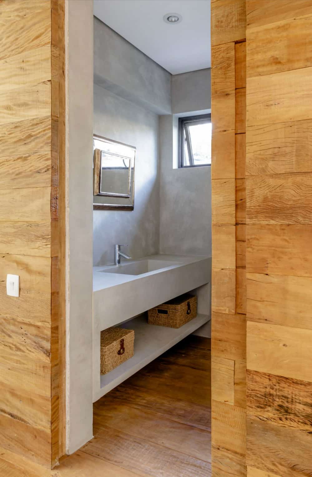 Concrete bathroom with a built-in vanity