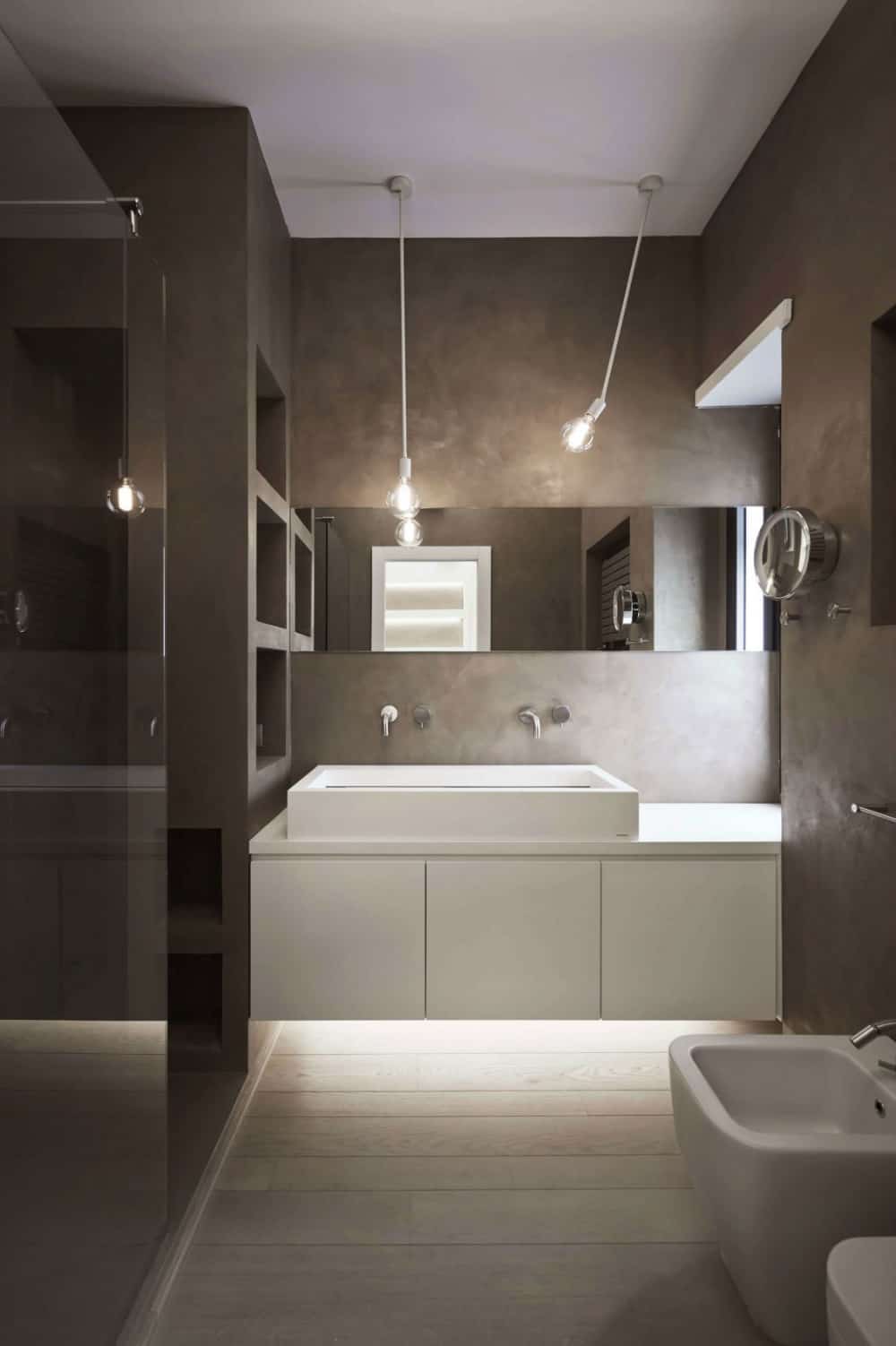 Concrete bathroom with white ambient lights