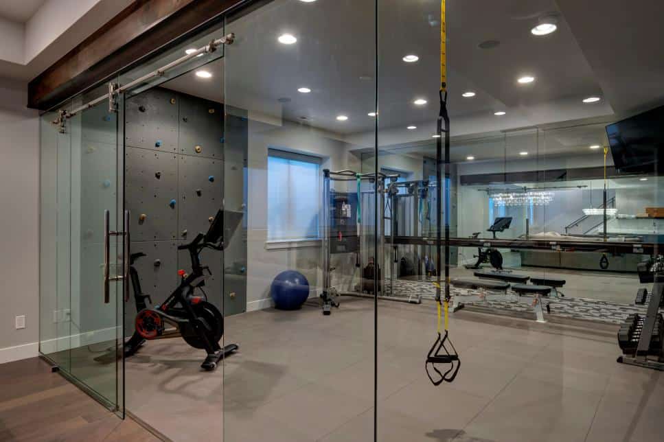 Glass ecnlosed gym by Finished Basement Company
