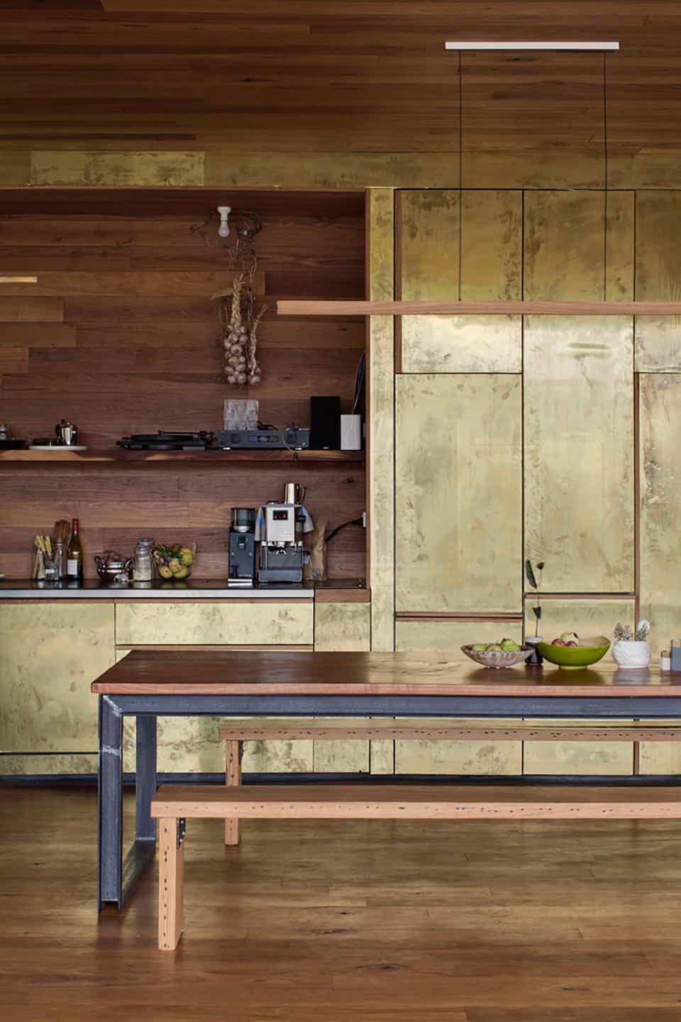 Kitchen cabinets are covered with brass