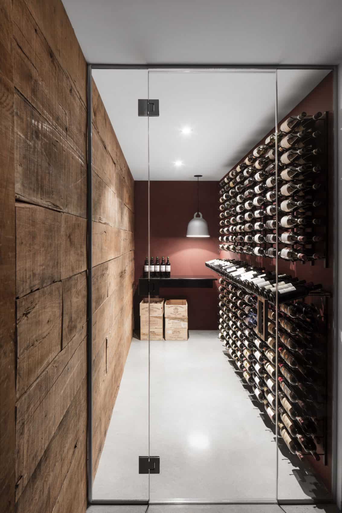 Wine cellar in a small room with a glass door