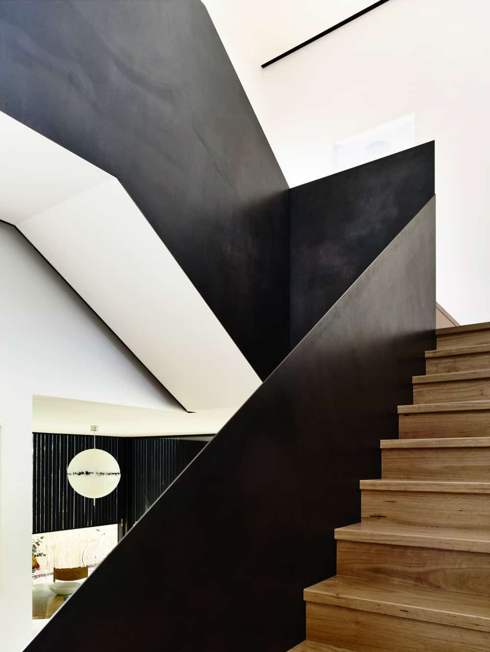 Wooden staircase comes with metal railing