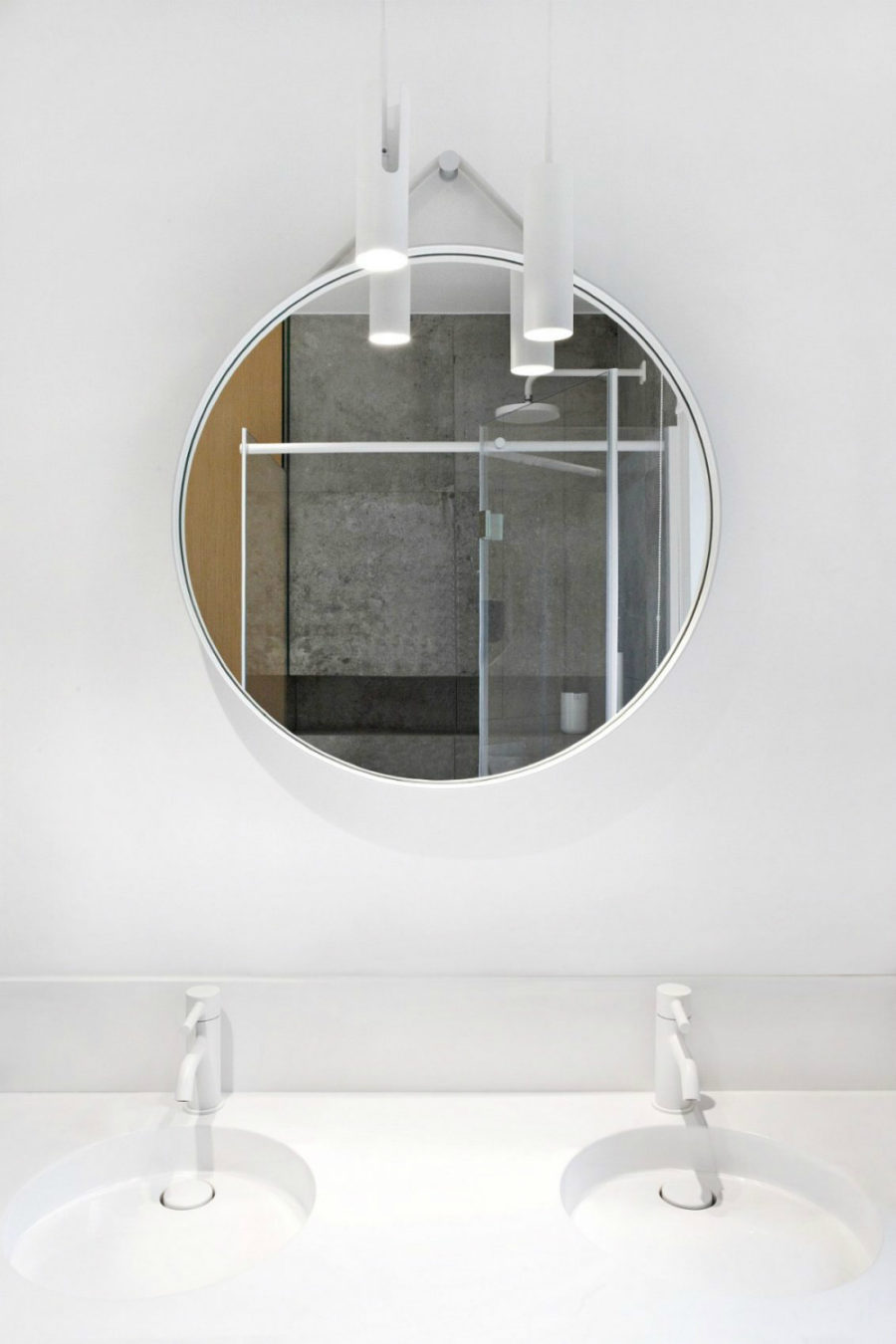 A hanging round mirror looks most contemporary