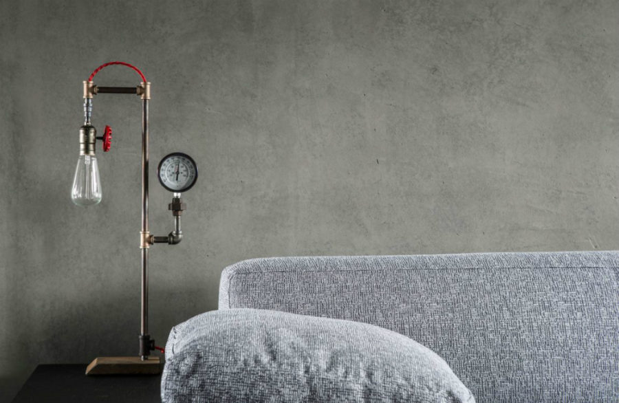 A side table lamp adds an unexpected industrial touch to the contemporary home