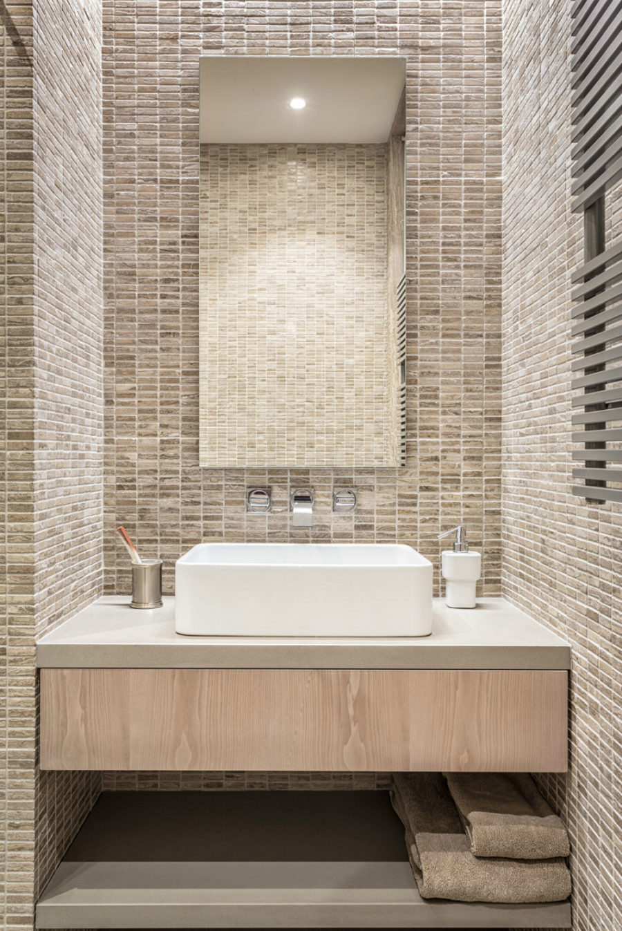 Another bathroom makes use of mini brick-like tiles