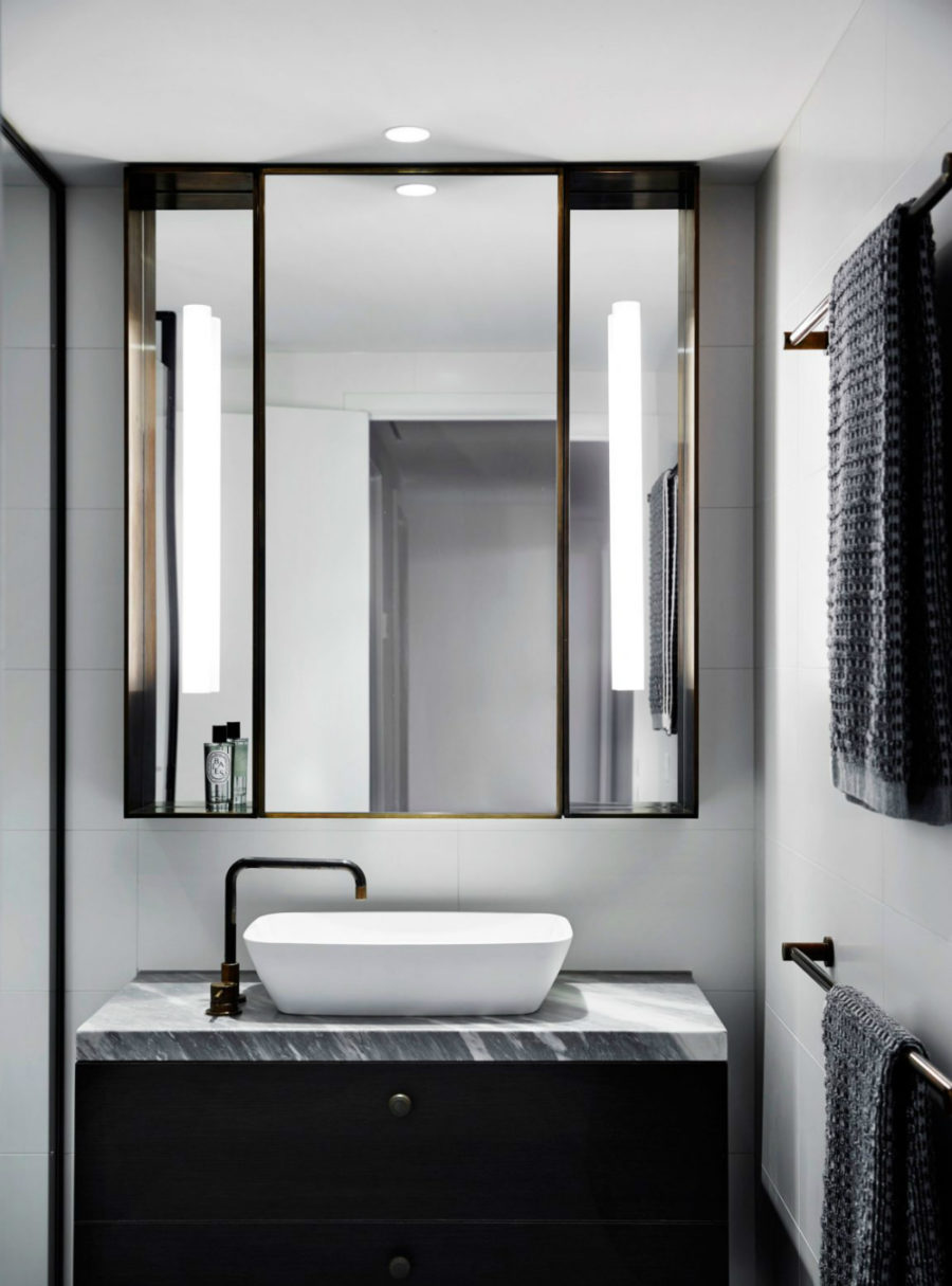 Bathroom's triple fold mirror looks almost Art Deco