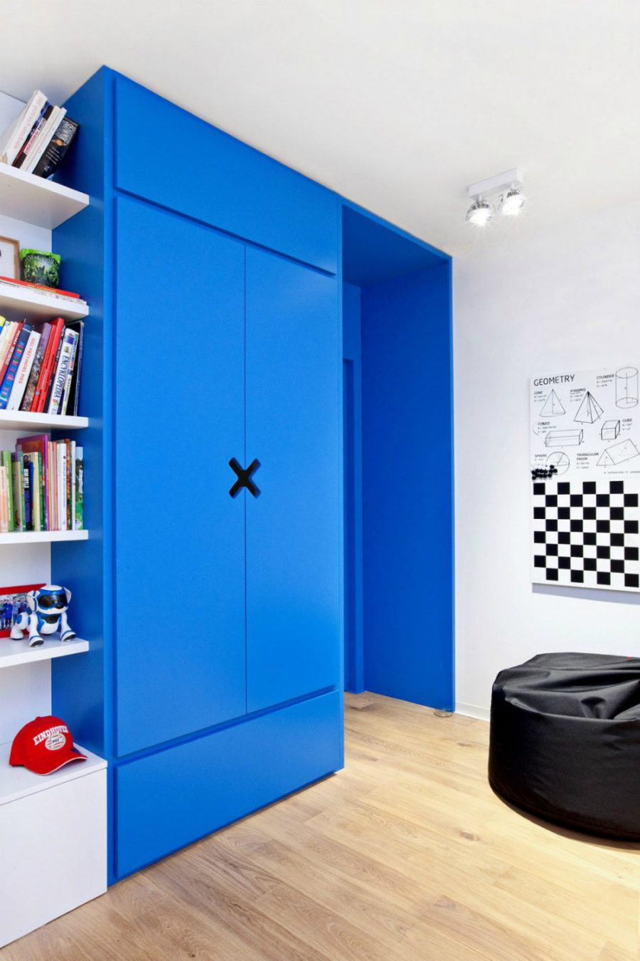 Bright blue closet makes for another bright element in a white room