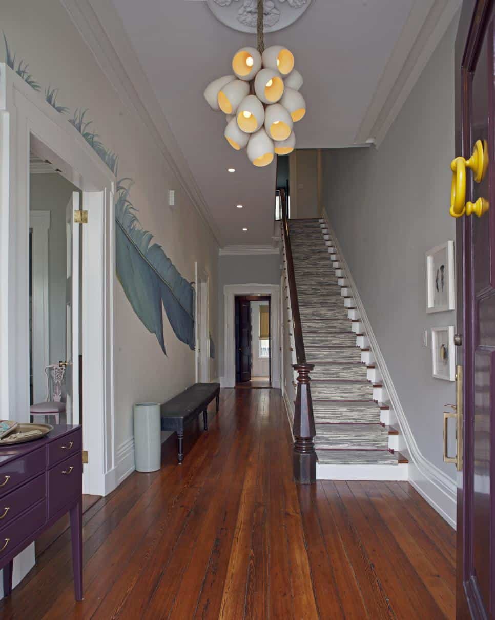 Colorful modern foyer by Rethink Design Studio