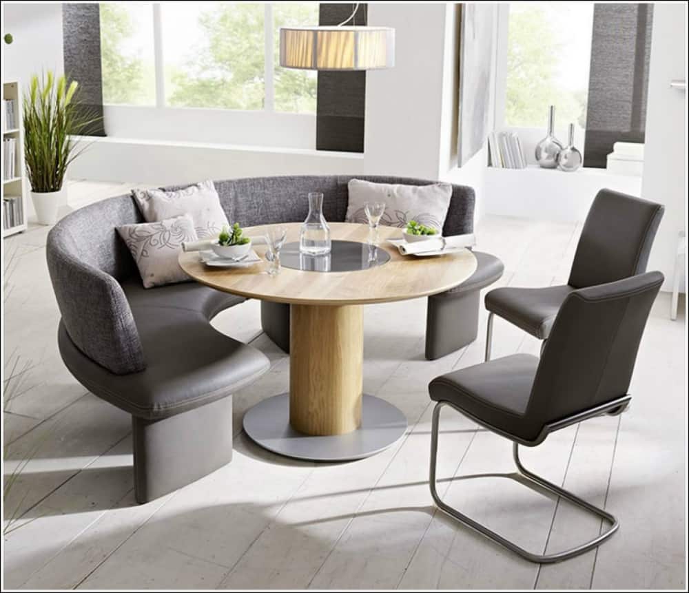 Contemporary dining room with a curved seat