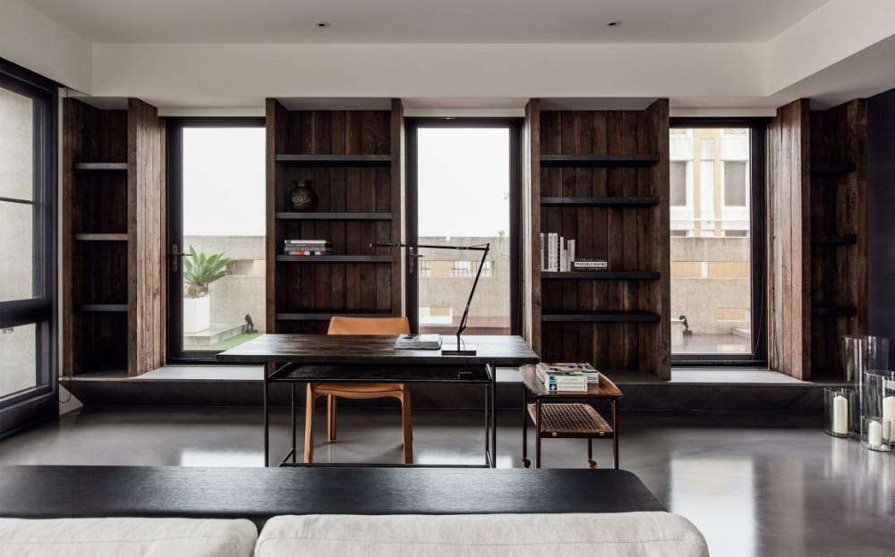 Home office adjoins the living room contributing to the contemporary open layout