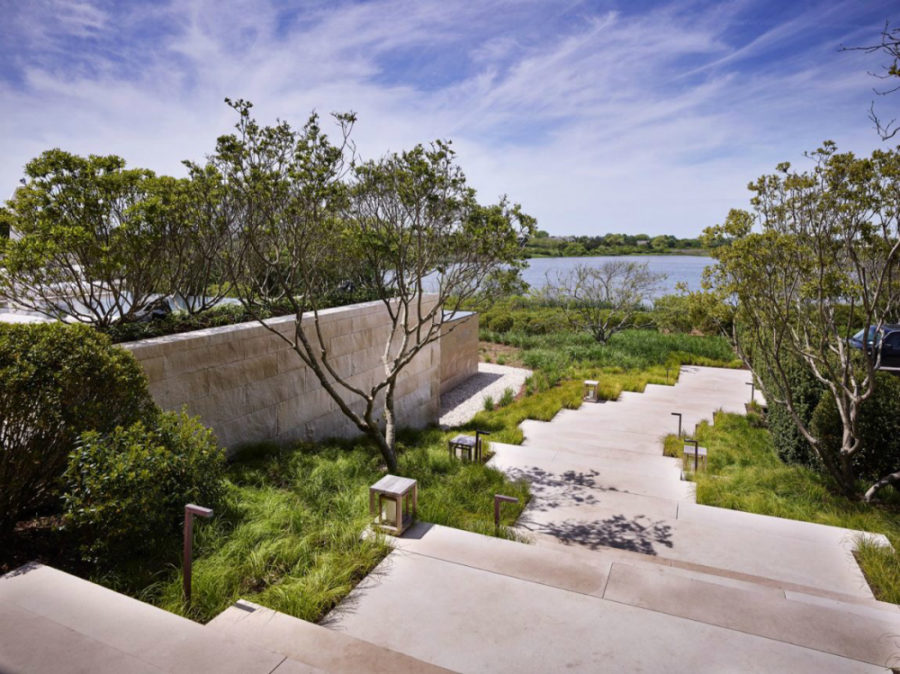 Meadow grass surrounds the staircase access