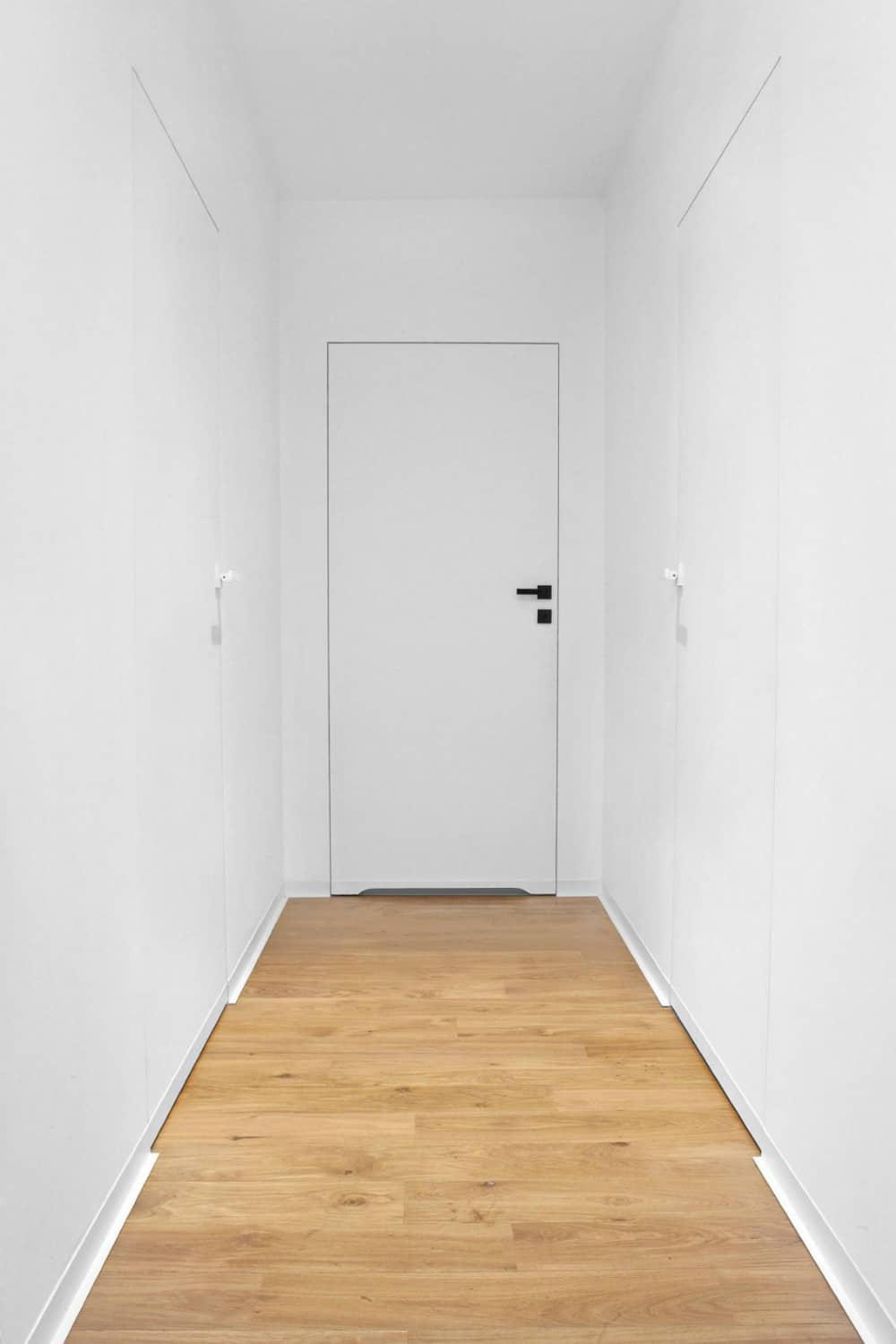 Minimal white hallway looks sterile