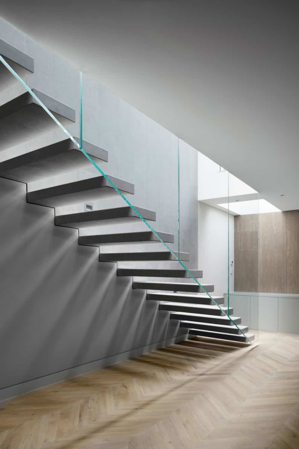 Staircase glass railing leaves the space open and airy