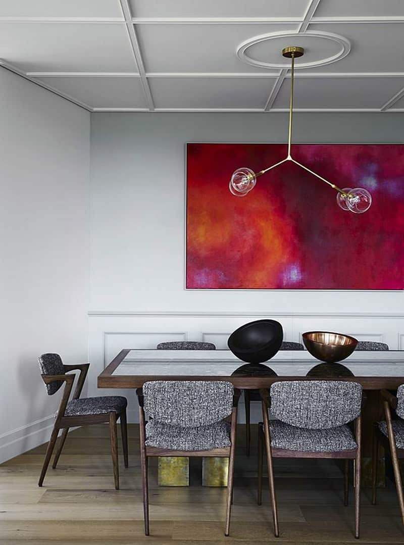 The dining room follows the fool-proof arrange of furniture, lighting, and artwork