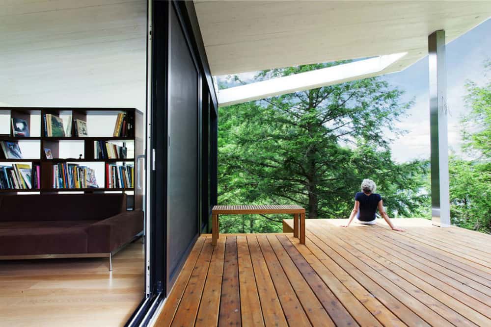 The living room has an access to the under-roof wooden deck