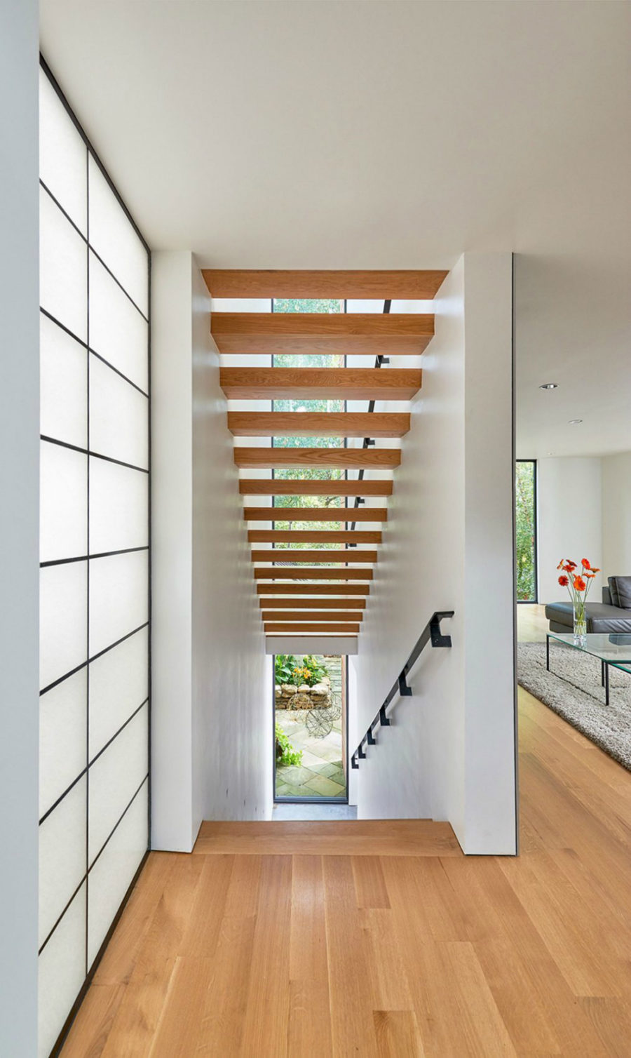 Wooden staircase is airy and open