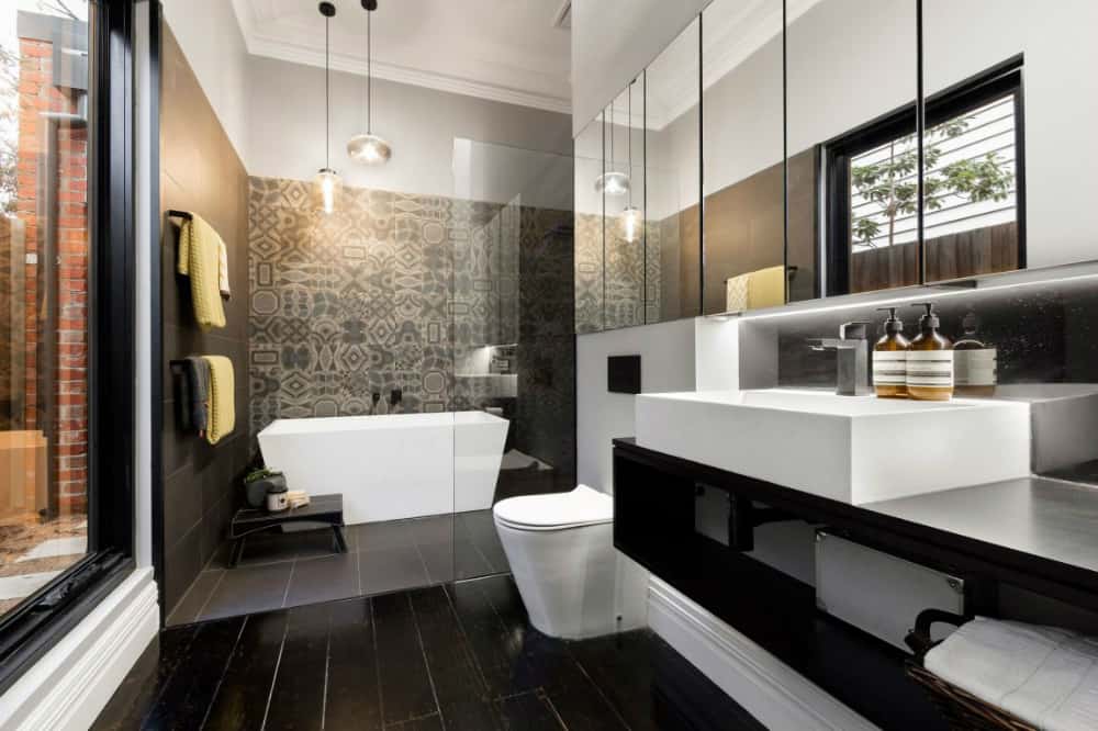 A more dramatic bath with a tiled feature wall