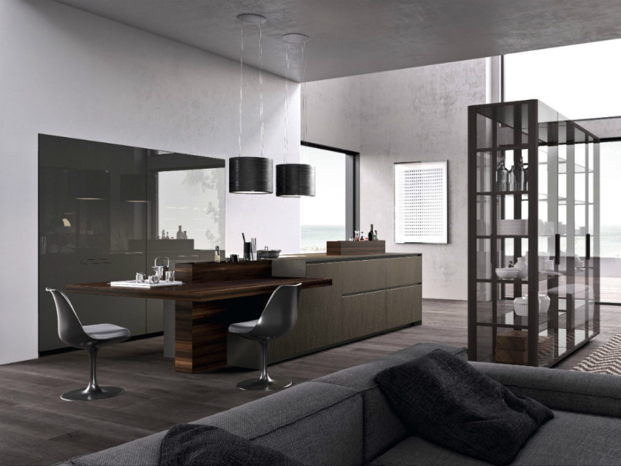 Alumina island kitchen with glass tableware shelving by Comprex