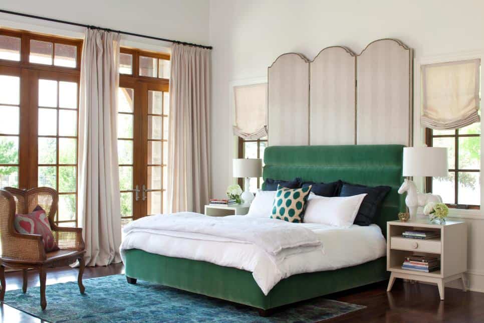 Dramatic double headboard in a bedroom by Andrea Schumacher