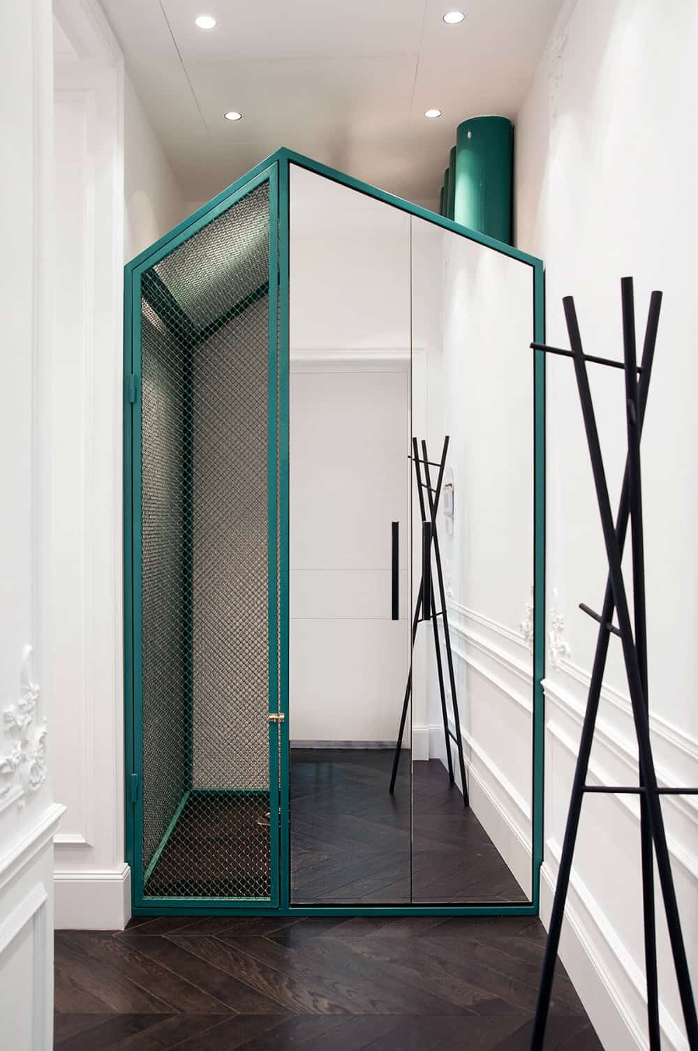 House within a home closet in the hallway amplifies space with a mirror