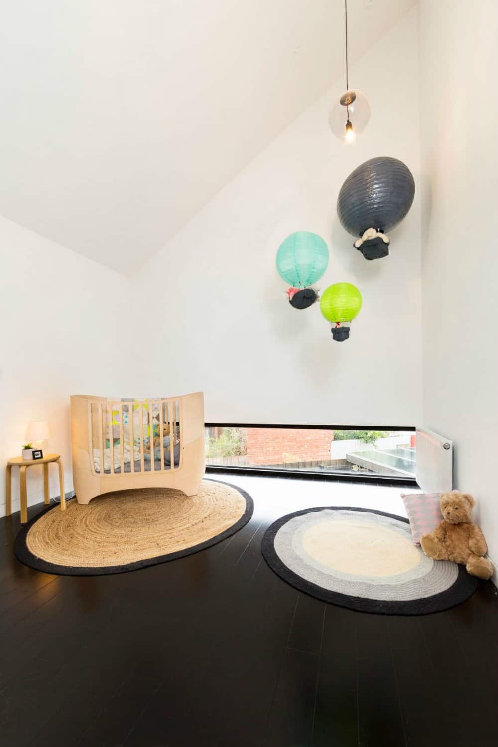 Kids room overlooks the backyard through a small transom