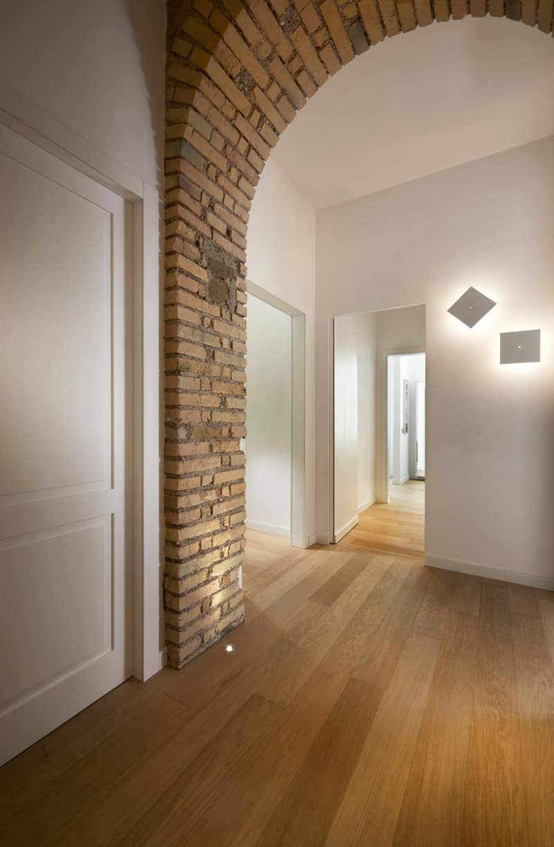 A brick arc looks unexpected and yet fitting in a transition space