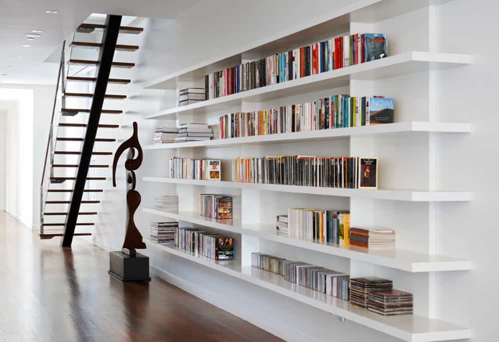 Under staircase library by Magdalena Keck Interior Design