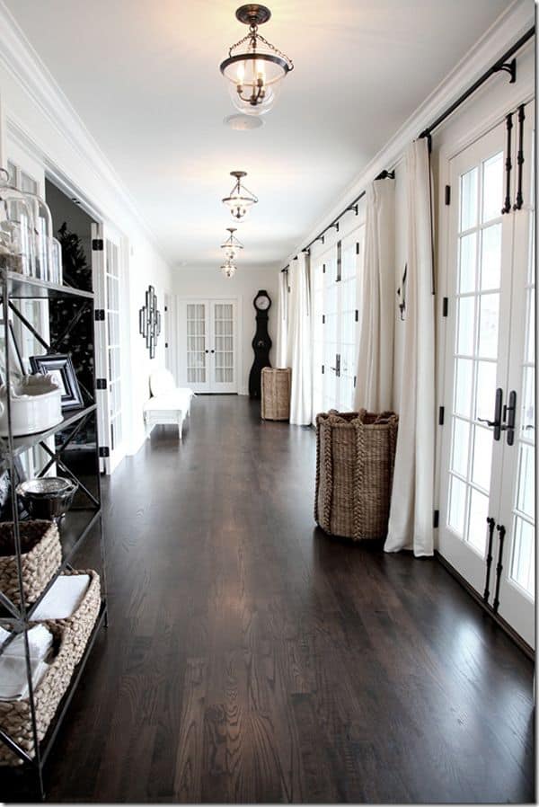 Clean White Hallway With Dark Floors